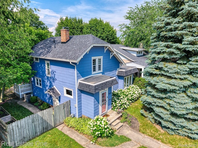 904 Michigan Ave, East Lansing, MI 48823 - view of front of house featuring a chimney and a shingled roof