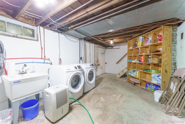 904 Michigan Ave, East Lansing, MI 48823 - unfinished below grade area featuring washer and clothes dryer and stairs