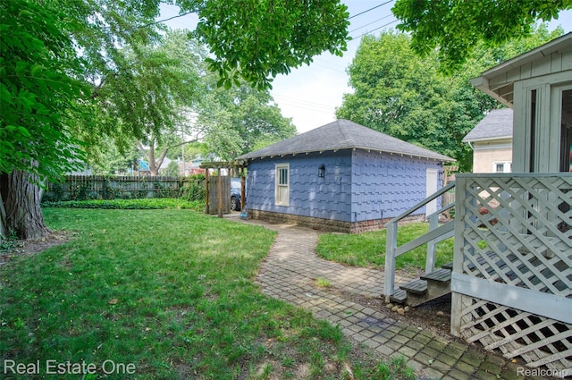904 Michigan Ave, East Lansing, MI 48823 - view of yard featuring an outdoor structure and a deck