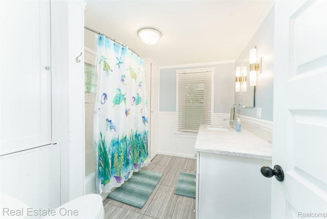 904 Michigan Ave, East Lansing, MI 48823 - bathroom featuring vanity and shower / tub combo with curtain