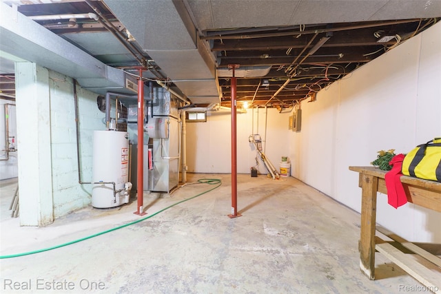 904 Michigan Ave, East Lansing, MI 48823 - unfinished basement featuring gas water heater, heating unit, and electric panel