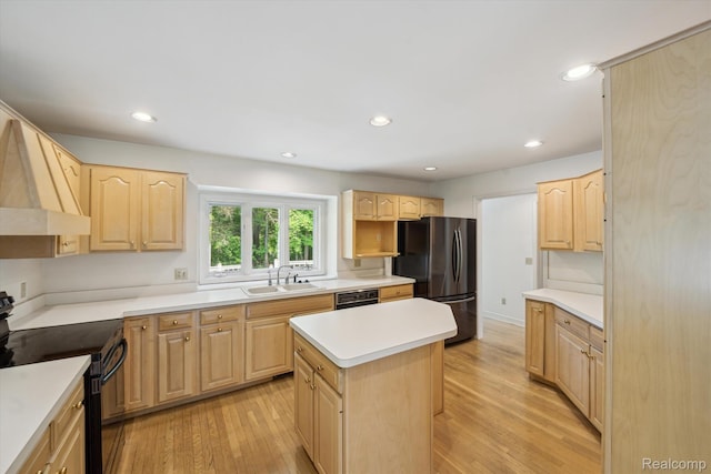 4270 Argenta Dr, Brighton, MI 48116 - kitchen with black appliances, light brown cabinets, light wood-style flooring, light countertops, and recessed lighting