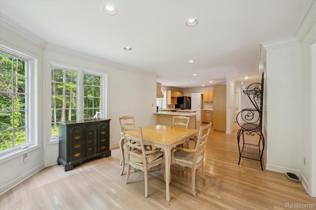 4270 Argenta Dr, Brighton, MI 48116 - dining space with plenty of natural light, crown molding, recessed lighting, and light wood finished floors