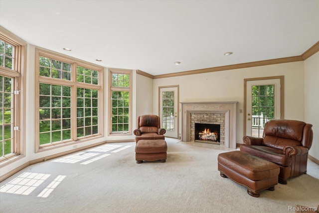 4270 Argenta Dr, Brighton, MI 48116 - carpeted living area with healthy amount of natural light, ornamental molding, a brick fireplace, and recessed lighting