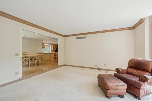 4270 Argenta Dr, Brighton, MI 48116 - sitting room with light carpet, crown molding, and recessed lighting