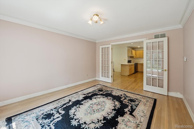 4270 Argenta Dr, Brighton, MI 48116 - spare room with french doors, crown molding, and light wood-style floors
