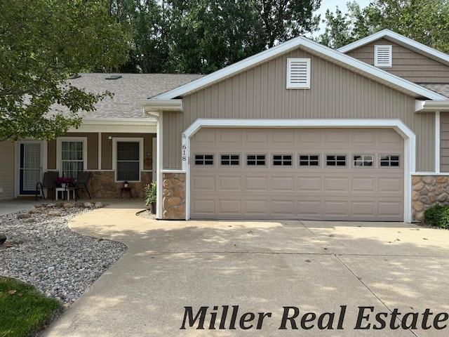 618 Riverwalk St, Hastings, MI 49058 - view of front of home featuring stone siding, a garage, concrete driveway, and a shingled roof