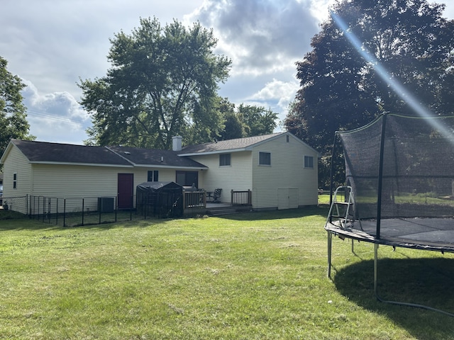 137 Apperson Rd, Battle Creek, MI 49015 - view of yard with a trampoline and a deck