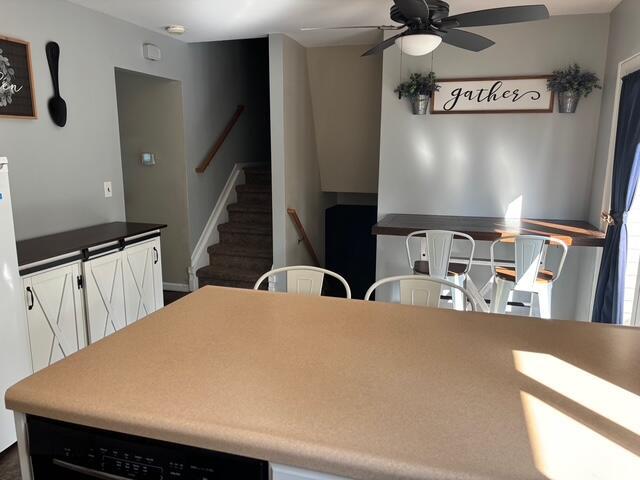 137 Apperson Rd, Battle Creek, MI 49015 - dining room with a ceiling fan and stairway