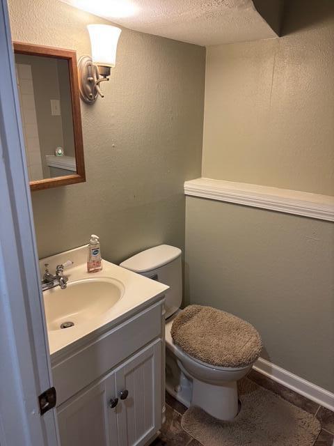 137 Apperson Rd, Battle Creek, MI 49015 - bathroom featuring vanity, tile patterned floors, and a textured ceiling