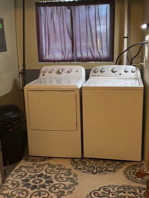 137 Apperson Rd, Battle Creek, MI 49015 - laundry area with washer and clothes dryer and electric panel
