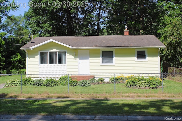 4901 Alpha Way, Flint, MI 48506 - ranch-style house with a chimney and roof with shingles