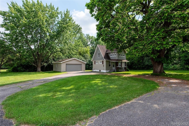 11740 Schram St, Grand Blanc, MI 48439 - view of front of home with an outdoor structure, a detached garage, and a front lawn