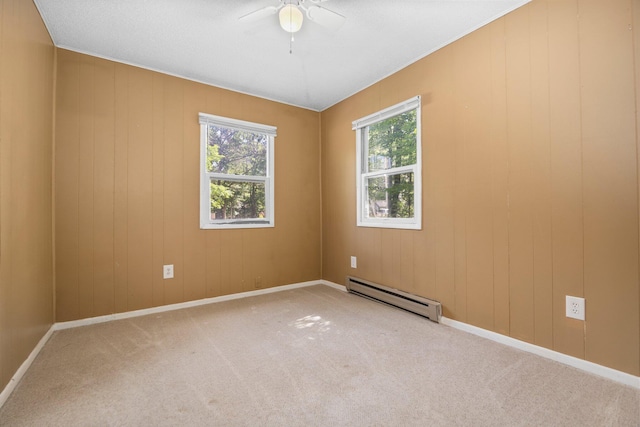 6353 Birchwood Dr, Lake, MI 48632 - carpeted empty room featuring a baseboard radiator and ceiling fan