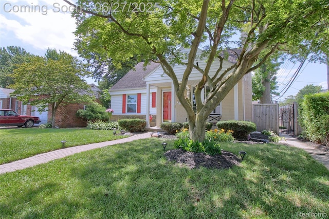 2371 Allard Ave, Grosse Pointe Woods, MI 48236 - view of front of house with brick siding, a gate, and a shingled roof