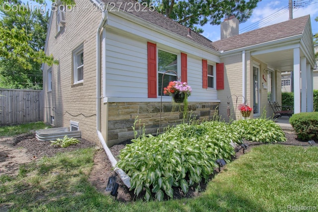 2371 Allard Ave, Grosse Pointe Woods, MI 48236 - view of side of home with a chimney and brick siding