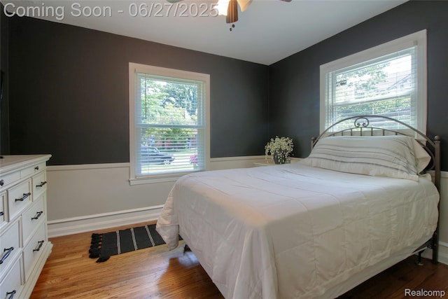 2371 Allard Ave, Grosse Pointe Woods, MI 48236 - bedroom featuring multiple windows, a wainscoted wall, wood finished floors, and ceiling fan