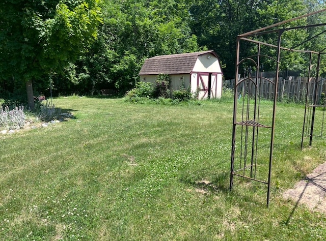 5344 Wheat Way Ave, Swartz Creek, MI 48473 - view of yard featuring a shed and a view of trees