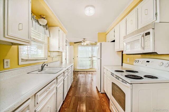 367 N Morrison Rd, West Branch, MI 48661 - kitchen with white appliances, dark wood-style flooring, light countertops, a ceiling fan, and white cabinetry