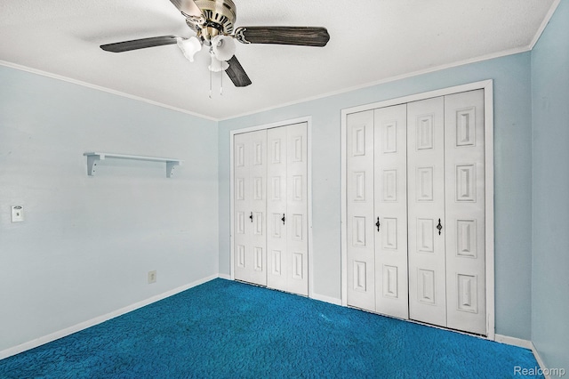 367 N Morrison Rd, West Branch, MI 48661 - unfurnished bedroom with two closets, crown molding, carpet floors, and ceiling fan