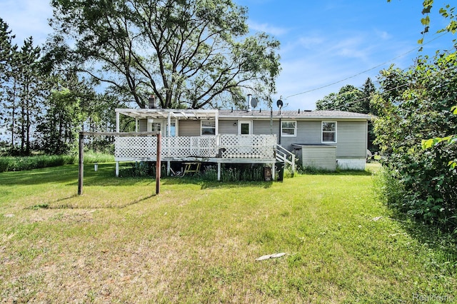 367 N Morrison Rd, West Branch, MI 48661 - back of house featuring a yard and a deck