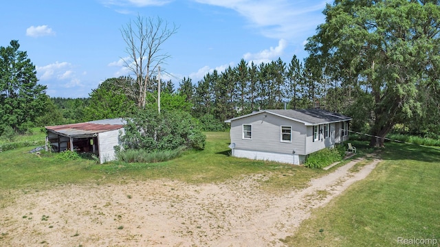 367 N Morrison Rd, West Branch, MI 48661 - view of grassy yard featuring dirt driveway