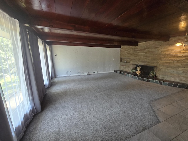 9361 W Parkway St, Detroit, MI 48239 - unfurnished living room with a wood ceiling with exposed beams, plenty of natural light, a fireplace, and carpet