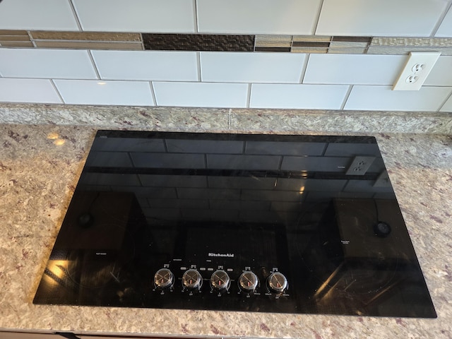 9361 W Parkway St, Detroit, MI 48239 - kitchen view of black electric stovetop and light stone counters