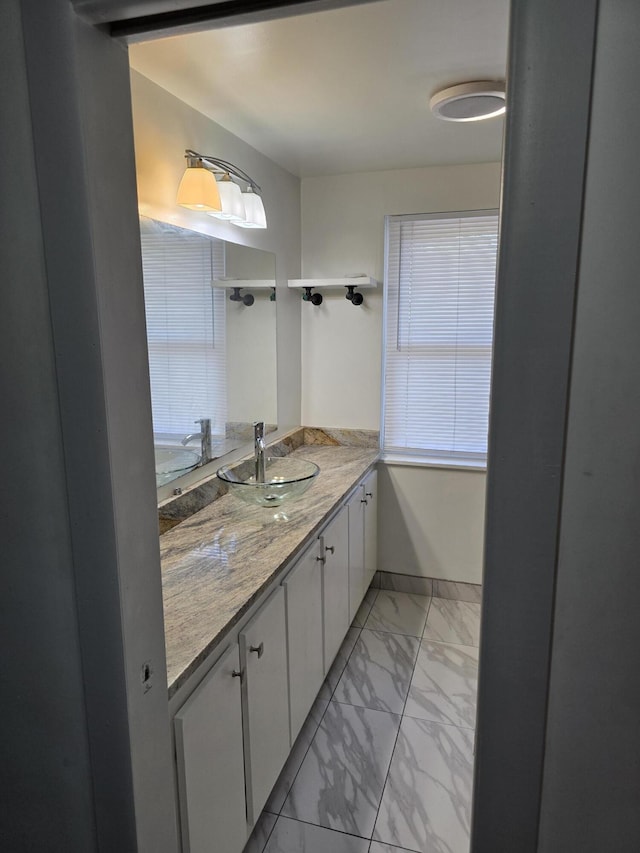 9361 W Parkway St, Detroit, MI 48239 - bathroom with marble look tiles and vanity