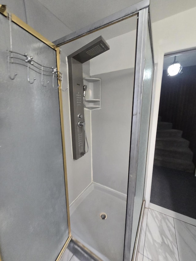 9361 W Parkway St, Detroit, MI 48239 - bathroom featuring a stall shower and marble look tiles