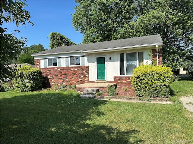 46985 Heydenreich Rd, Macomb, MI 48044 - view of front of house featuring brick siding and a front yard