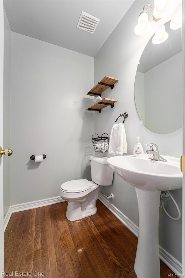 293 S Village Way, Canton, MI 48188 - half bath featuring toilet and wood finished floors