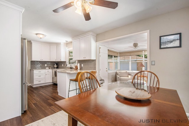 1538 10th St NW, Grand Rapids, MI 49504 - dining space with a ceiling fan and dark wood finished floors