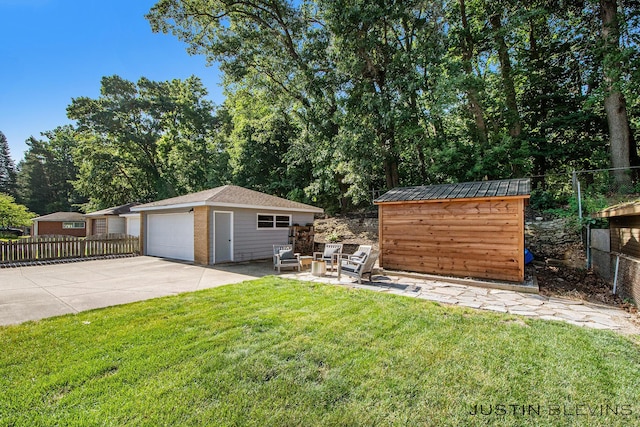 1538 10th St NW, Grand Rapids, MI 49504 - view of yard with an outbuilding, a detached garage, and view of scattered trees