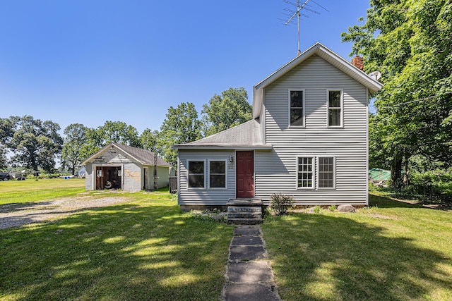 204 W Clay St, Sherwood, MI 49089 - view of front of home with a front yard, roof with shingles, an outbuilding, and a chimney