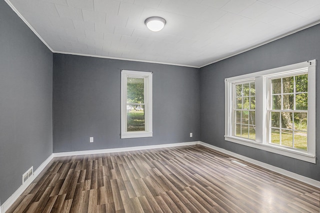 204 W Clay St, Sherwood, MI 49089 - empty room featuring crown molding, healthy amount of natural light, and dark wood-style floors