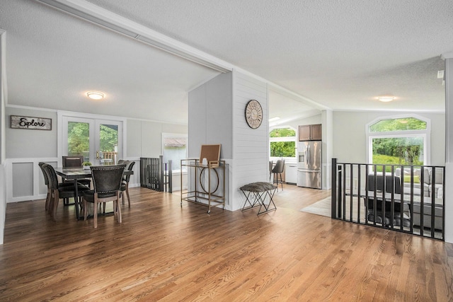 80150 46th Ave, Coloma, MI 49038 - dining space with lofted ceiling, a textured ceiling, and light wood-type flooring