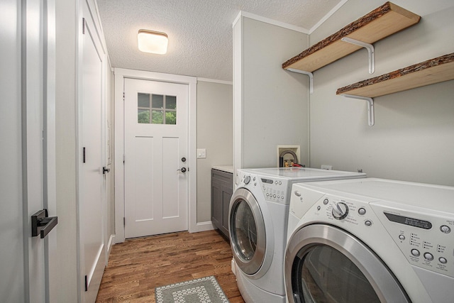80150 46th Ave, Coloma, MI 49038 - laundry area with cabinet space, washer and dryer, wood finished floors, and a textured ceiling