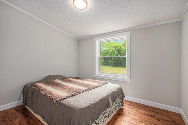 80150 46th Ave, Coloma, MI 49038 - bedroom with a textured ceiling, wood finished floors, and crown molding