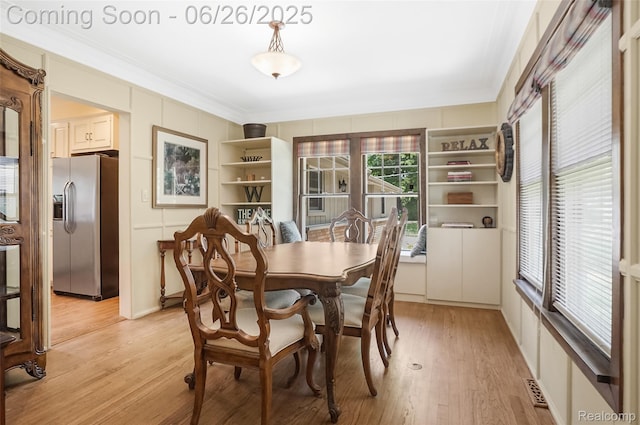 4725 Motorway Dr, Waterford, MI 48328 - dining area with crown molding and light wood finished floors