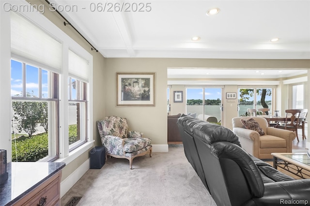 4725 Motorway Dr, Waterford, MI 48328 - living room with healthy amount of natural light, light colored carpet, a water view, beam ceiling, and recessed lighting