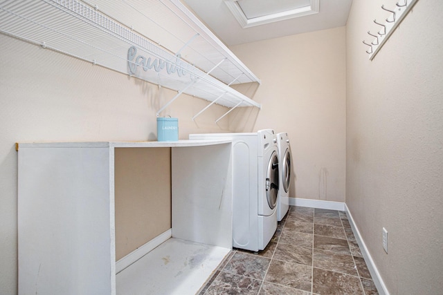 6061 Equestrian Woods Ct, Kalamazoo, MI 49009 - laundry room with washer and clothes dryer and stone finish flooring