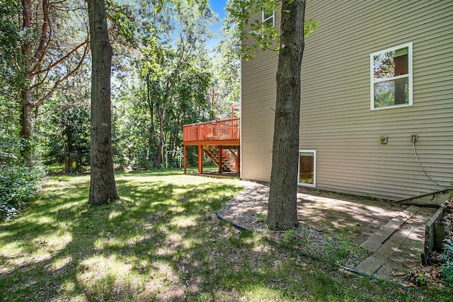 6061 Equestrian Woods Ct, Kalamazoo, MI 49009 - view of grassy yard with a wooden deck, stairway, and a patio