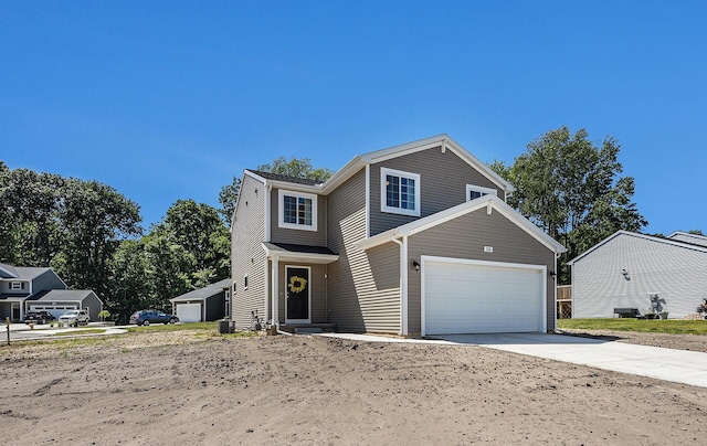 374 Lotz Ct, Wayland, MI 49348 - traditional-style house featuring an attached garage and concrete driveway