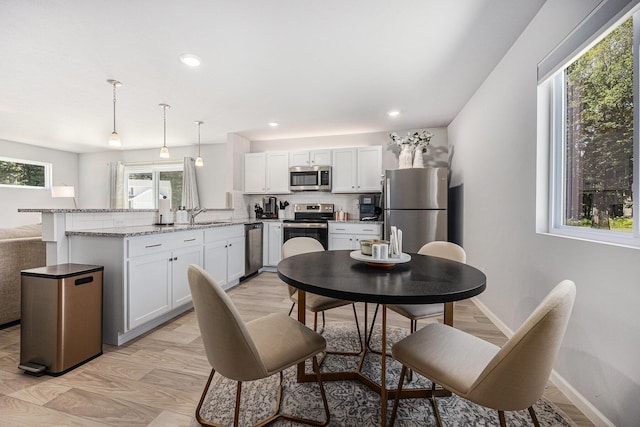 374 Lotz Ct, Wayland, MI 49348 - dining space featuring recessed lighting and light wood-style floors