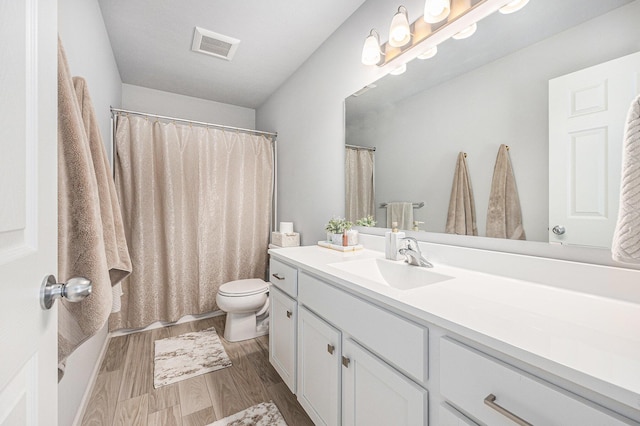 374 Lotz Ct, Wayland, MI 49348 - full bath featuring vanity, wood finished floors, and a shower with shower curtain