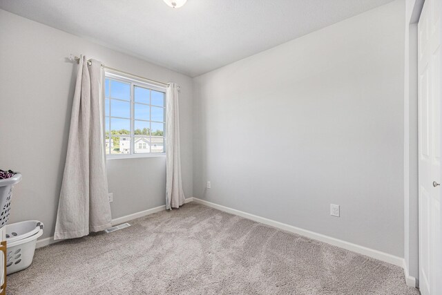 374 Lotz Ct, Wayland, MI 49348 - carpeted empty room featuring baseboards