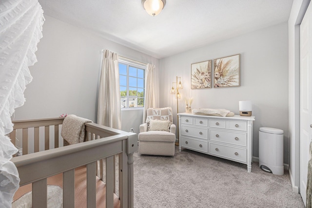 374 Lotz Ct, Wayland, MI 49348 - bedroom featuring light carpet and a nursery area