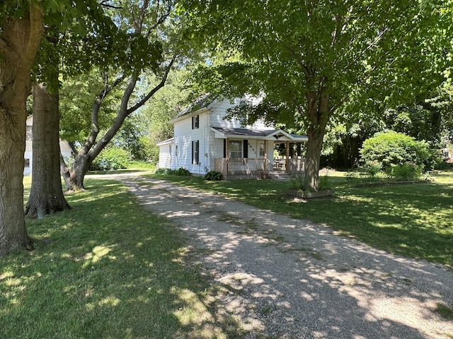 4641 Territorial Rd, Benton Harbor, MI 49022 - view of front of home featuring covered porch, driveway, and a front yard