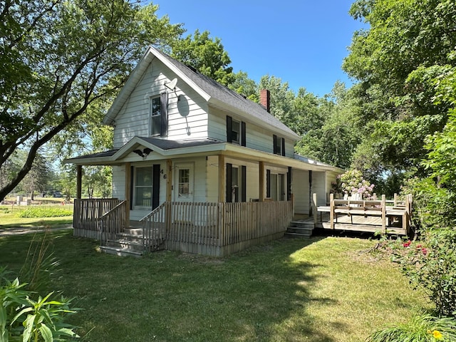 4641 Territorial Rd, Benton Harbor, MI 49022 - farmhouse inspired home with a porch, a chimney, and a front yard